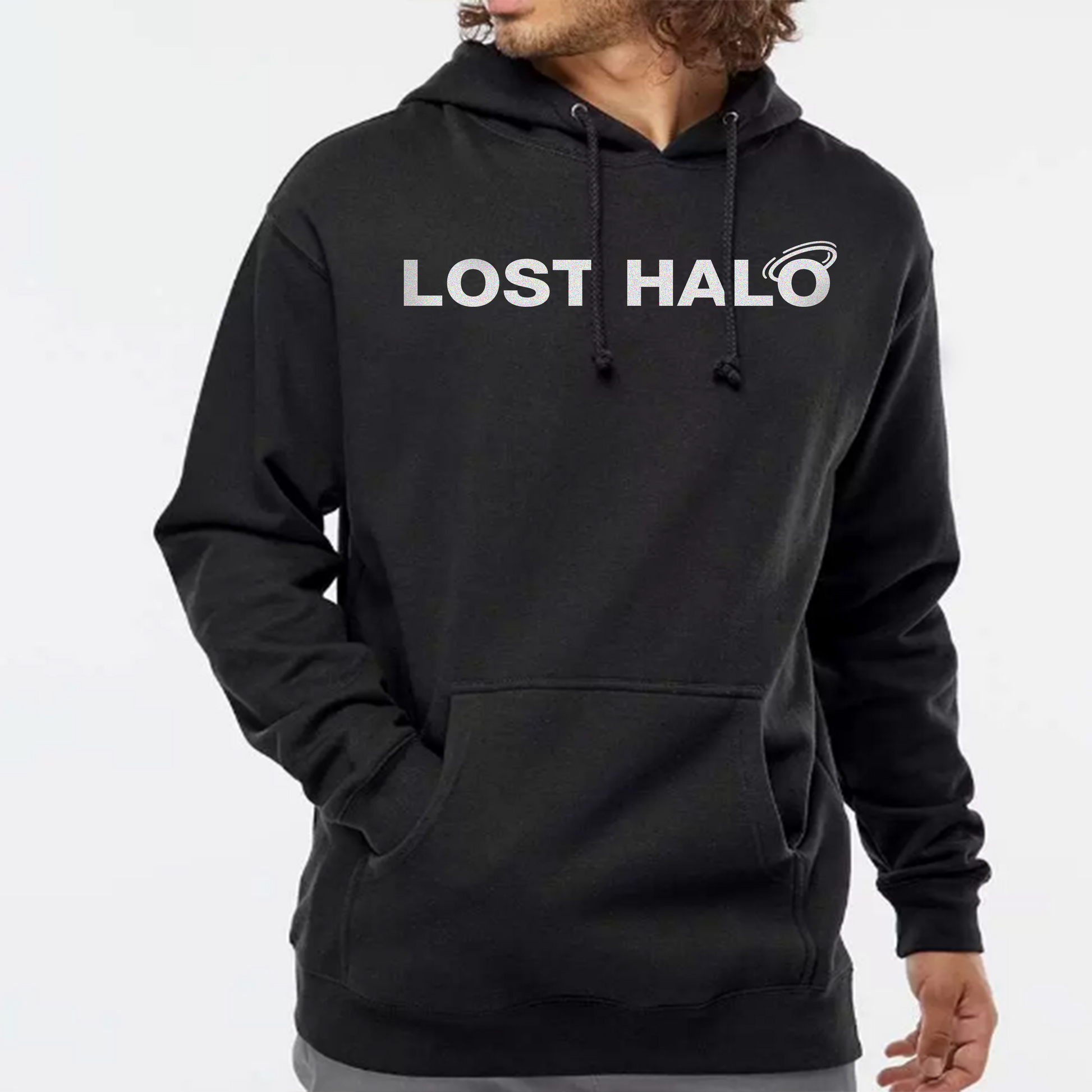 model wearing black hoodie with white Lost Halo logo printed on chest